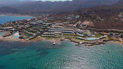 aerial view of crete coast with luxury hotels in chersonissos, greece