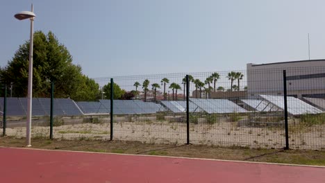 the entire field with solar panels that heat the water of an olympic swimming pool