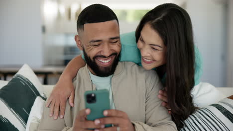 Love,-hug-and-couple-on-a-sofa-with-phone-happy