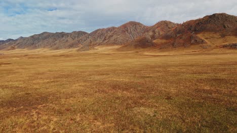 autumnal mountain range and grassland