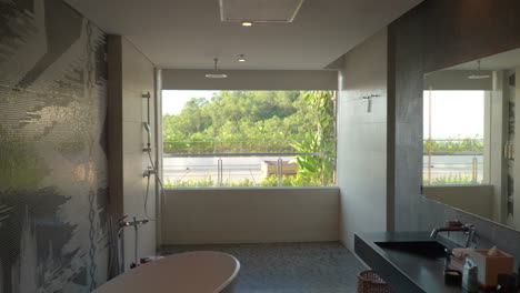 classy bathroom design with oval ceramic bathtub in renaissance bali uluwatu resort and spa in bali, indonesia