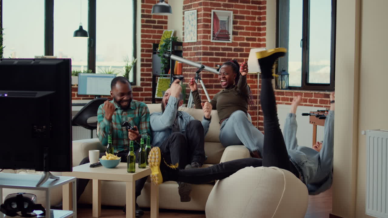 Diverse people winning video games on console
