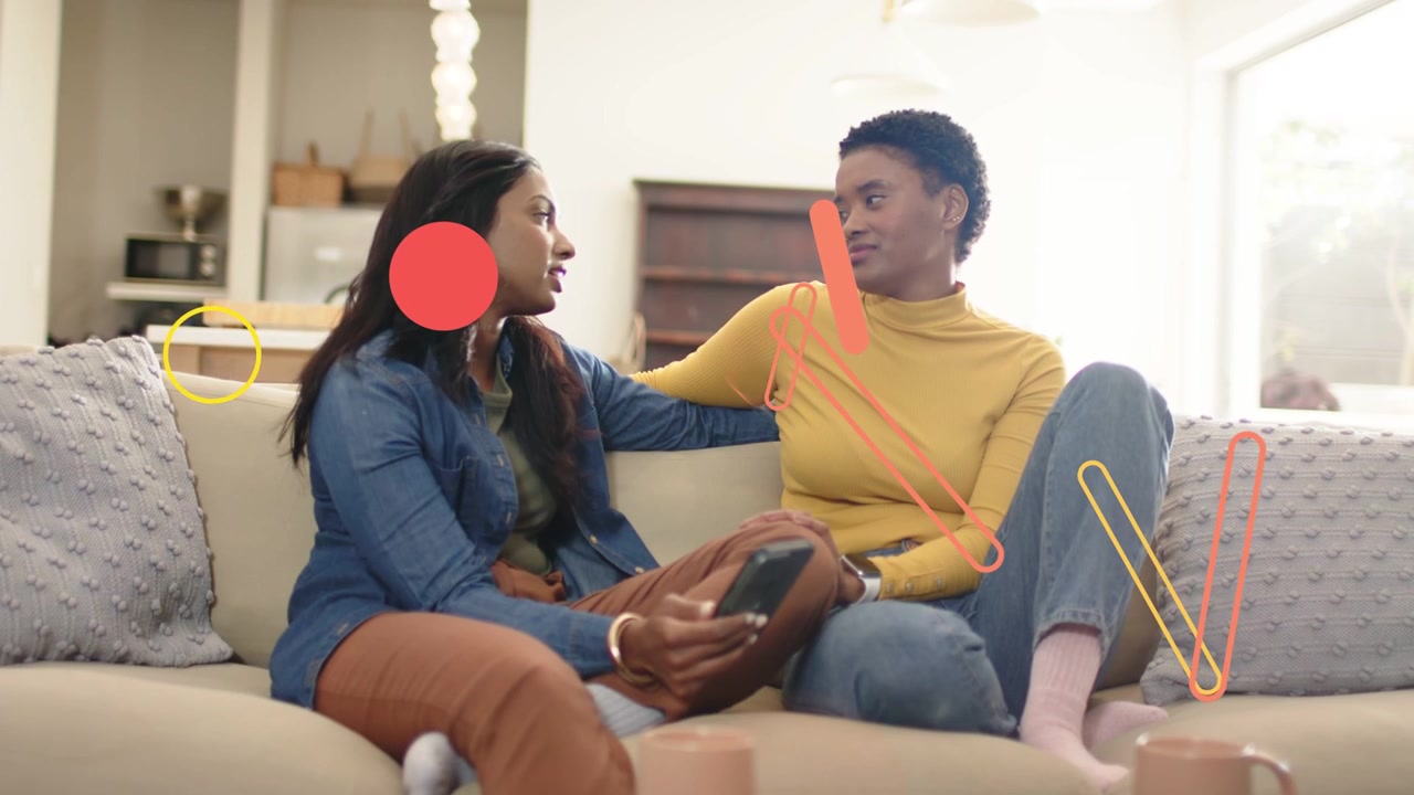 Couple on sofa left woman showing phone sharing and causing tech animations covering faces fading