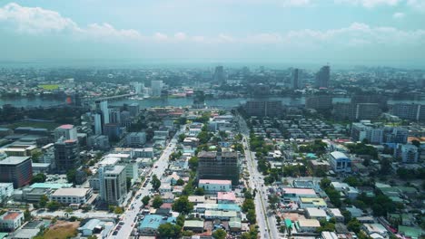 victoria island lagos, nigeria - 24 june 2021: drone view of major roads and traffic in victoria island lagos showing the cityscape, offices and residential buildings.