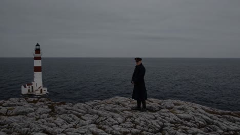 navy officer stands on a rocky coast, contemplating a solitary lighthouse in the distance, under a cloudy sky, evoking a sense of duty, solitude, and the maritime world
