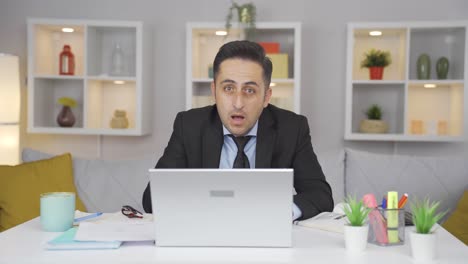 home office worker man looking at camera confused.