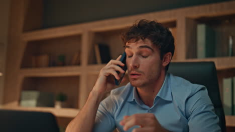 Emotional ceo yelling smartphone feeling mad of bad news in workplace close up.