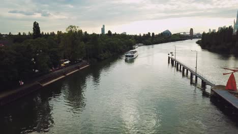 following a boat on the sewer of frankfurt am main germany, paning left