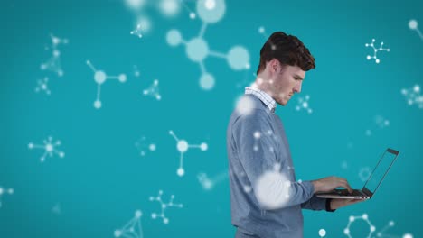 animation of caucasian man using his laptop and looking at floating molecules formulae on blue backg