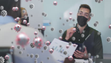 Animation-of-virus-cells-over-diverse-business-people-wearing-face-masks