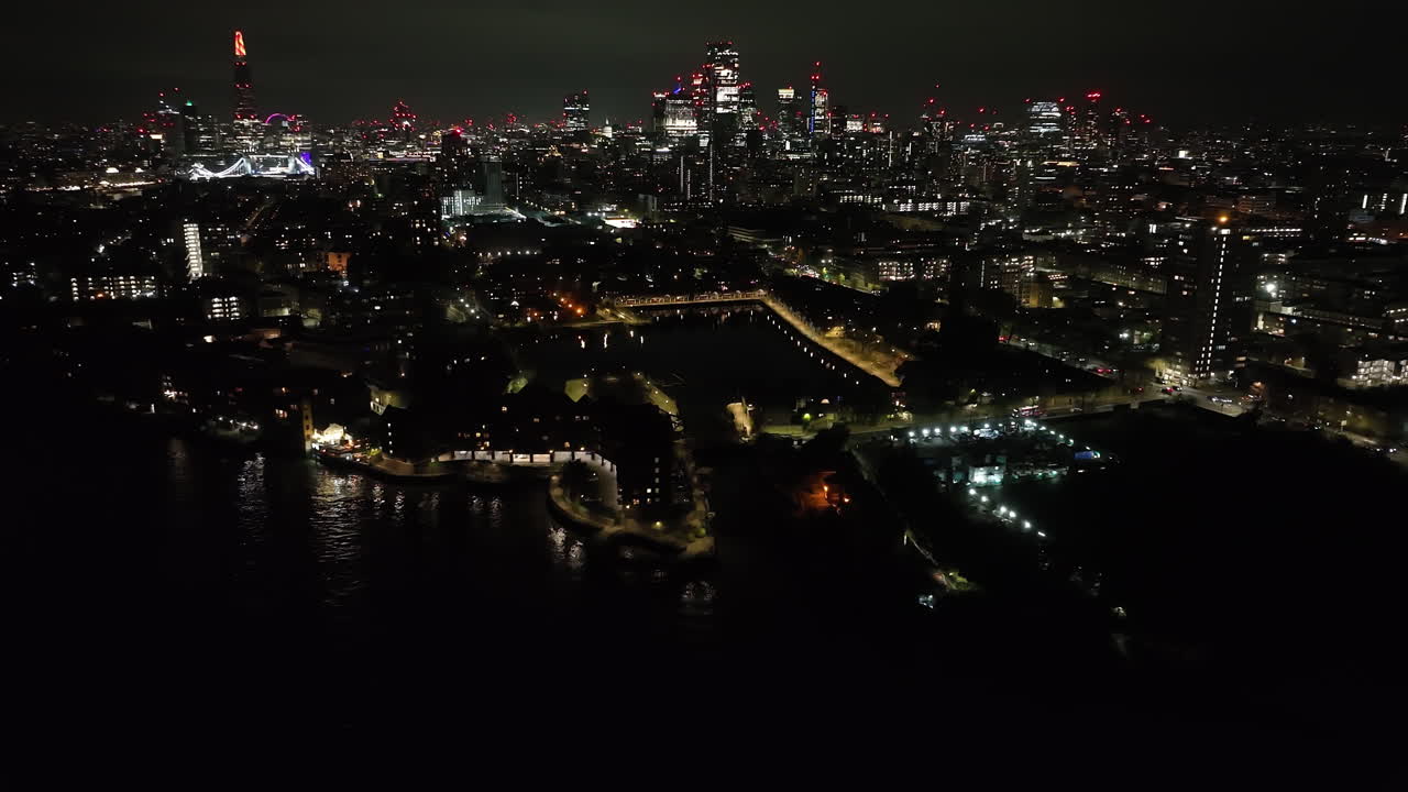 Panoramic drone shot orbiting the Shadwell basin, evening in London, England