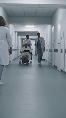 hospital corridor with doctors and patient