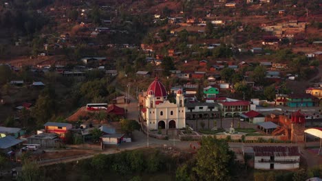 parroquia san mateo rio hondo, parish church in samename town, mexican highlands on sunset sunlight, revealing drone aerial view