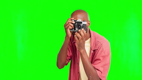 Photographer,-camera-with-a-black-man-on-a-green