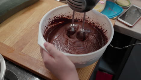 Mixing-chocolate-dough-with-dough-mixer-at-home-kitchen