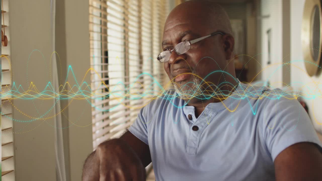 Senior man gazing at computer activating audio waveform visualization tech and smiling in response