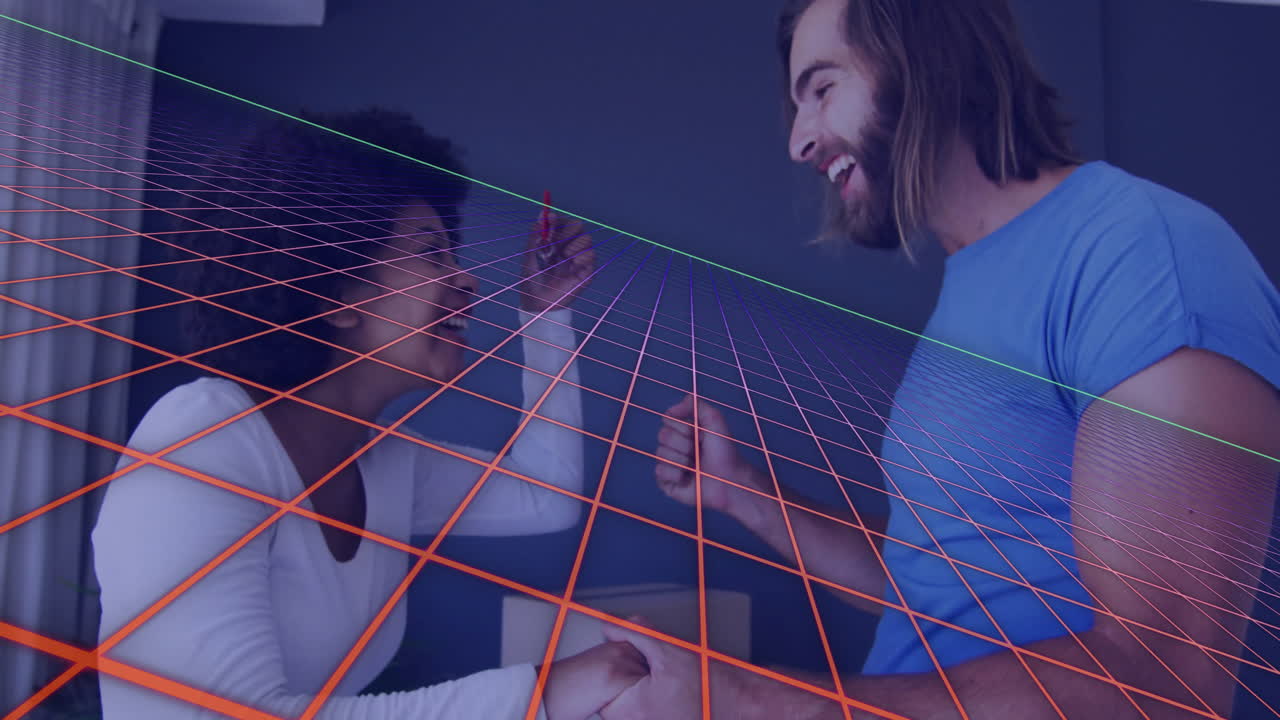 Interacting with animation, smiling couple exploring digital grid in modern setting