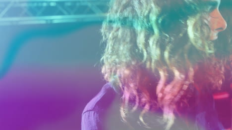 female performer showcasing lighting tech, with animated teal magenta overlays highlighting truss
