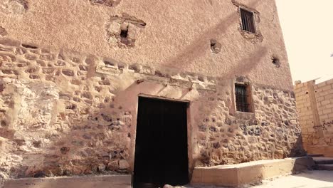 an old village in the middle of the desert with the style of arab house