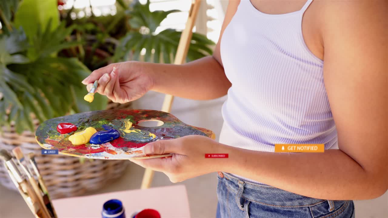 Woman artist mixing paint, dipping brush, sparking social LIKE overlays over palette, gaining fans