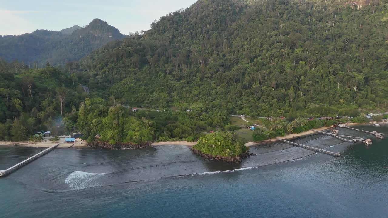 Drone aerial view of indonesian coastline padang west sumatra tropical ocean rainforest jungle trees