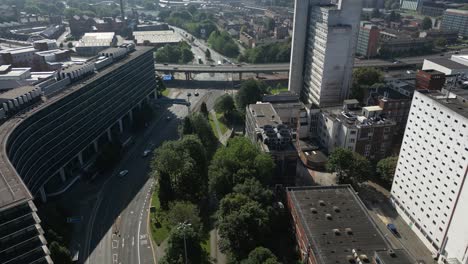 Aerial-drone-flight-towards-The-Mancunian-Way-over-London-Road-with-a-view-of-The-MacDonald-House