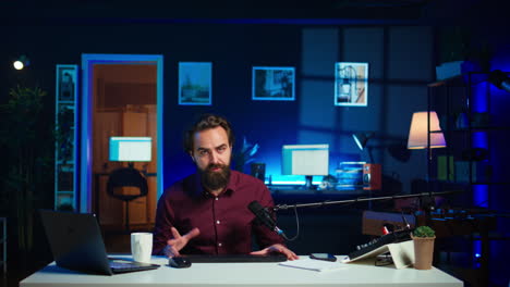 man filming video for online channel, presenting mouse and keyboard