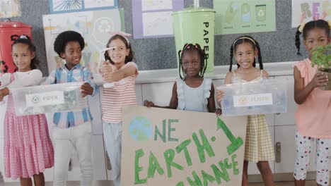 portrait of happy diverse children in elementary school ecology awareness class, slow motion