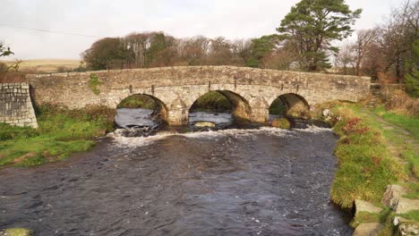 View-of-bridges-of-rough-stone-in-the-middle-of-the-national-park-in-the-English-country-side-with-a-stream-under-it