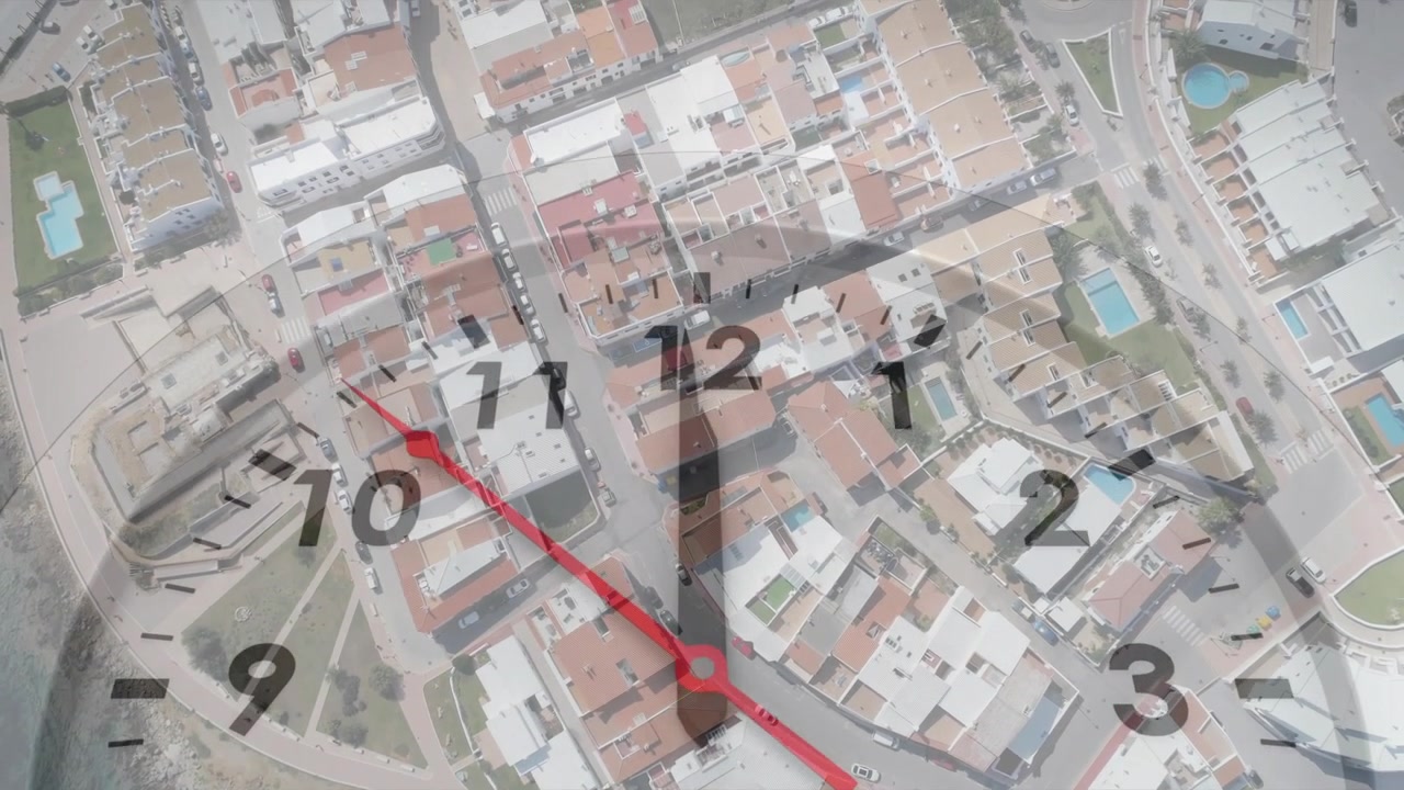 Shoreline drone pan starting clock overlay, red-hand rotating, aerial panning inland, showing time