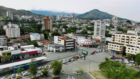 buildings, trees and mountains