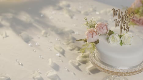 close up of wedding cake on decorated table at wedding reception 1