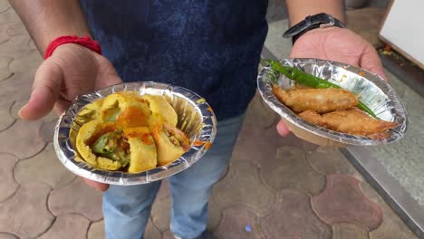 outdoor shot of masala mirch and samosa in a street side in india