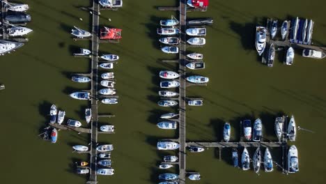 aerial birds eye view white boats and luxury yachts moored in marina