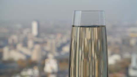 cityscape view through champagne glass