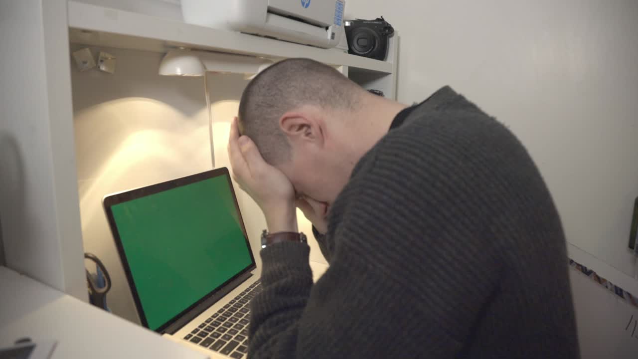 A Young Man Keeps On Checking The Time On His Wristwatch And Feeling Tires After Working On His Laptop.- closeup shot