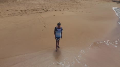 a model enjoying beach views in a fishing village on the north western coast of tobago, castara