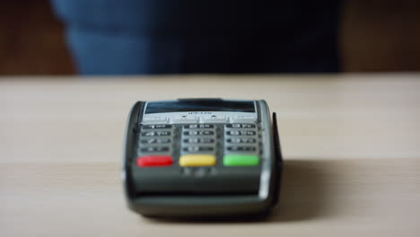 contactless pay using phone with chroma key screen at bank pos terminal close up