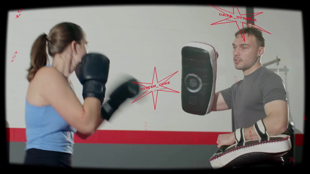 Vertical video: Trainer shifting pads, boxer throwing punches for boxing, red overlay marking hits