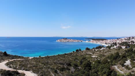 a drone shot of the town of primosten in croatia