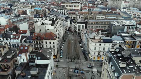 Aerial-close-flight-over-Brussels'-streets-on-cloudy-day,Belgium