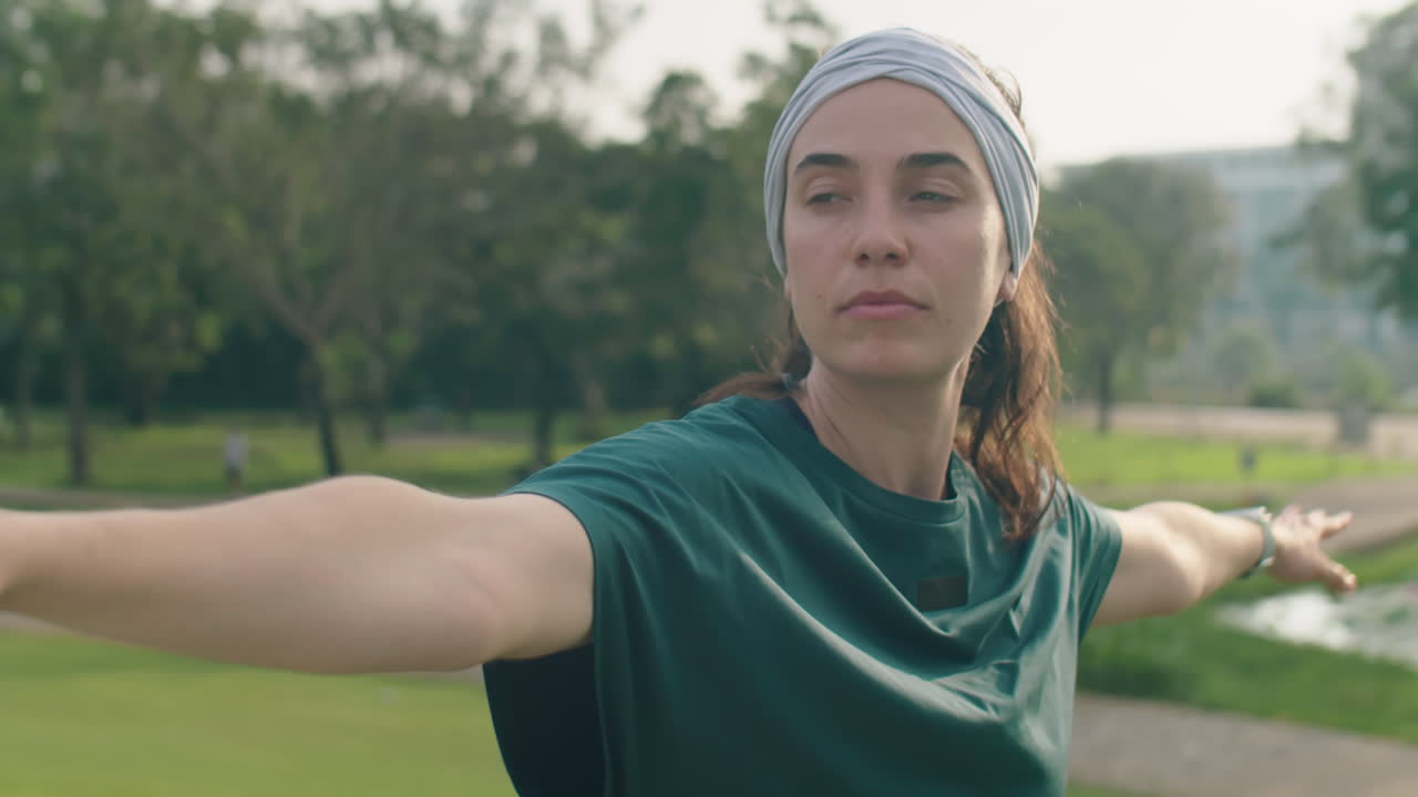 Woman Practicing Yoga Asana in Park