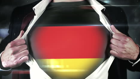 businessman opening shirt to reveal german flag