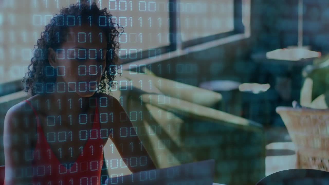 woman typing on laptop in modern café, overlaying streaming binary code graphics for technology