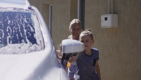 family washing the car