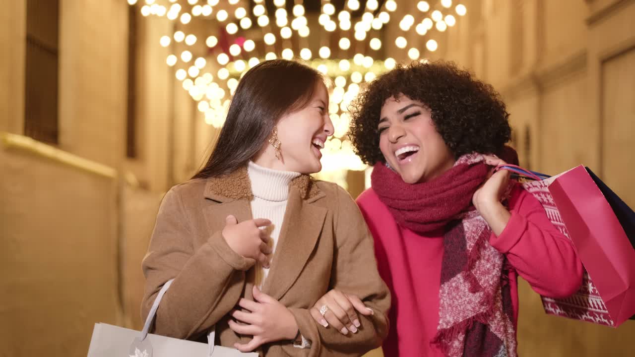 Two women shopping at night