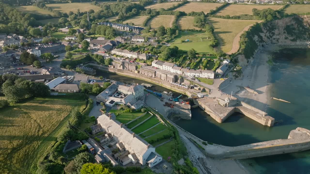 Quaint harbour village surrounded by fields. Charlestown, Cornwall, UK.
