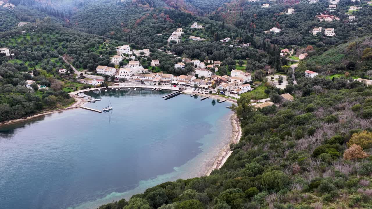 Picturesque coastal village with olive groves and blue sea aerial view Corfu Greece travel