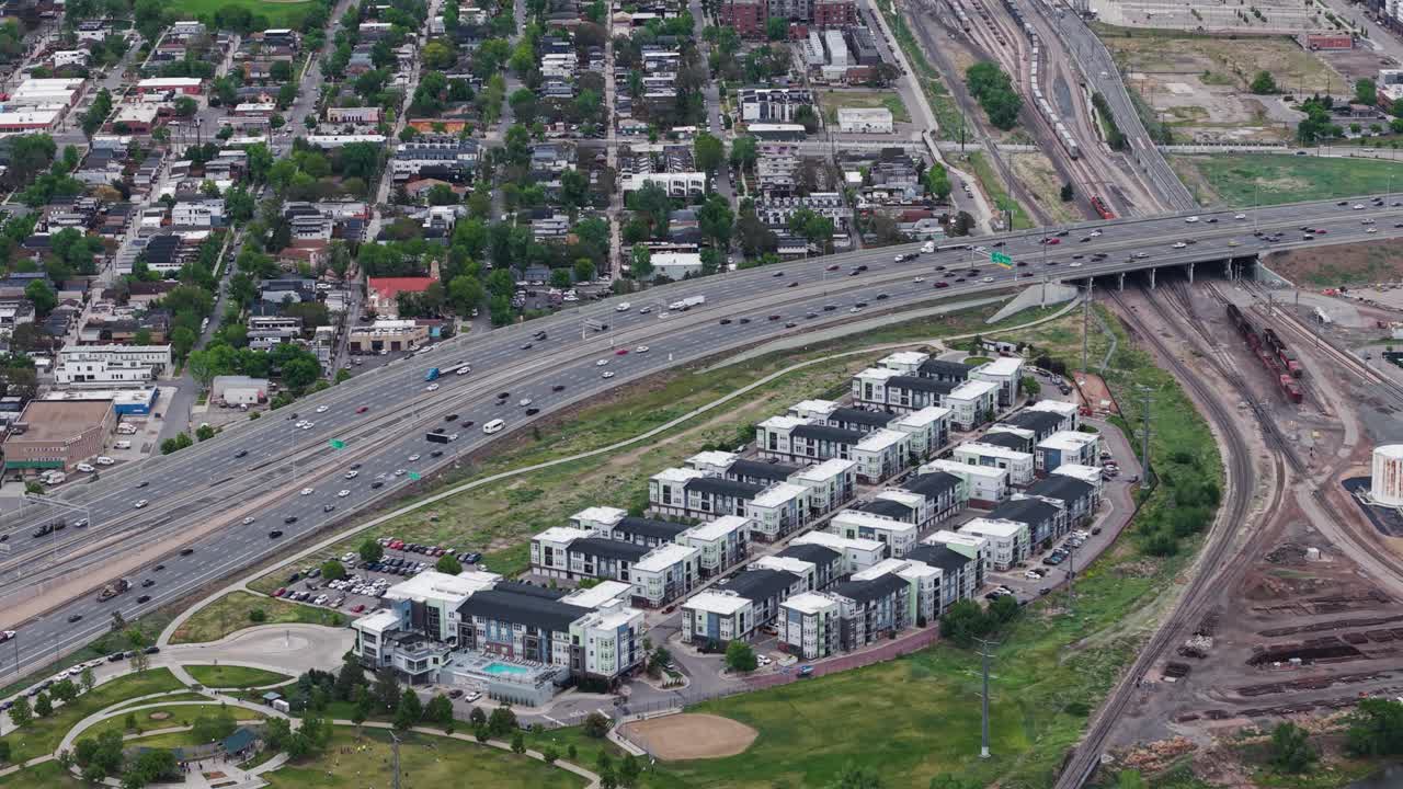 Telephoto drone shot of traffic on Interstate 25, cloudy, summer day in Denver