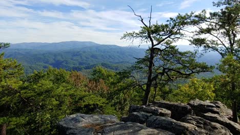 a view of the great smoky mountains national park with the wind blowing filmed on a rock cliff in the foothills parkway located in the smoky mountains